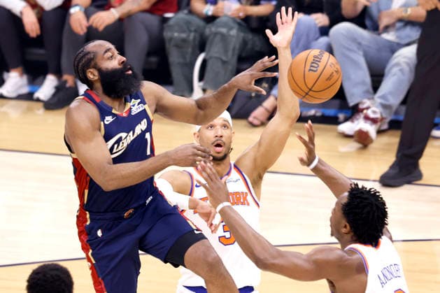 Cleveland Cavaliers James Harden (1) drops off a pass by New York Knicks Josh Hart (3) and OG Anunoby (8) during the first quarter of their Eastern Conference Final game in Cleveland, Ohio Saturday May 23, 2026.  CLE20260523102 AARONxJOSEFCZYK