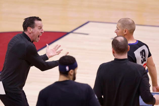 Cleveland Cavaliers head coach Kenny Atkinson argues a call with official Tyler Ford (39) during the first quarter against the New York Knicks in the first quarter of their Eastern Conference Final game in Cleveland, Ohio Saturday May 23, 2026.  CLE20260523104 AARONxJOSEFCZYK