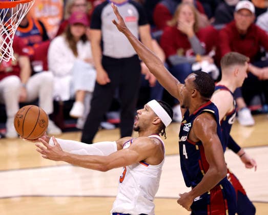 New York Knicks Josh Hart (3) lays up a shot while defended by Cleveland Cavaliers Evan Mobley (4) during the second quarter of their Eastern Conference Final game in Cleveland, Ohio Saturday May 23, 2026.  CLE20260523124 AARONxJOSEFCZYK