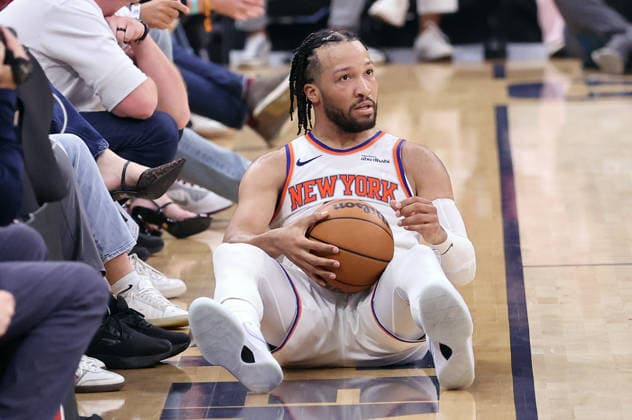 New York Knicks Jalen Brunson (11) looks up after being fouled by Cleveland Cavaliers Max Strus (2) during the third quarter of the Eastern Conference Final game in Cleveland, Ohio Saturday May 23, 2026.  CLE20260523126 AARONxJOSEFCZYK