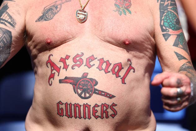 London, England, 24th May 2026. Arsenal fan with an Arsenal tattoo celebrates during the Crystal Palace vs Arsenal Premier League match at Selhurst Park, London. Picture credit should read: Paul Terry Sportimage EDITORIAL USE ONLY. No use with unauthorised audio, video, data, fixture lists, club league logos or live services. Online in-match use limited to 120 images, no video emulation. No use in betting, games or single club league player publications. SPI_030_PT_Palace_Arsenal SPI-4818-0025