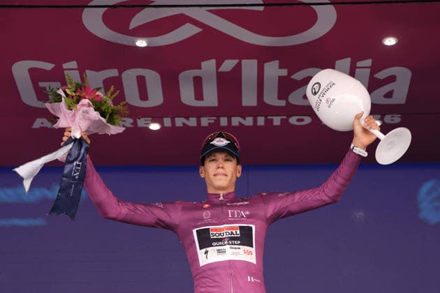 The cyclamen jersey France™s Paul Magnier of Soudal Quick-Step celebrate on the podium after the Stage 15 of the Giro d™Italia, from Voghera to Milano, Italy, Sunday, May 24, 2026.  Copyright: xMassimoxPaolone LaPressex