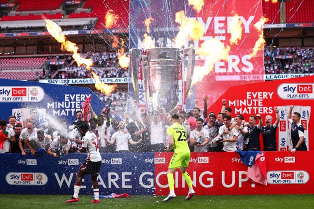 London, England, 24th May 2026. Bolton Wanderers lift the trophy during the Bolton Wanderers vs Stockport County Sky Bet League 1 play off final match at Wembley Stadium, London. Picture credit should read: Jake Youle Sportimage EDITORIAL USE ONLY. No use with unauthorised audio, video, data, fixture lists, club league logos or live services. Online in-match use limited to 120 images, no video emulation. No use in betting, games or single club league player publications. SPI_027_JY_Stockport_County_Bolton_Wanderers SPI-4821-0027