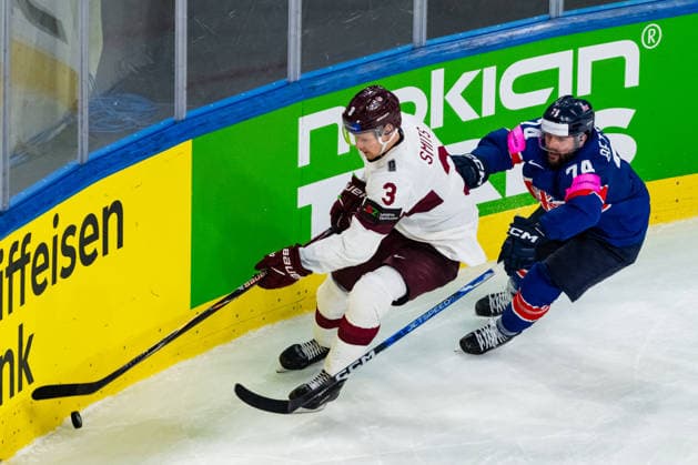 ZURICH, SWITZERLAND - MAY 24: Oliver Betteridge (Great Britain, 74) in the battle for the puck with Alberts Smits (Latvia, 3) during the Preliminary Round - Group A Match 43 between Great Britain and Latvia at the IIHF Ice hockey, Eishockey World Championship, WM, Weltmeisterschaft 2026, Swiss Life Arena on May 24, 2026 in Zurich, Switzerland. Zurich Switzerland Copyright: xTimoxSteinx