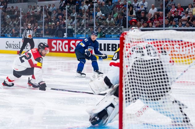 ZURICH, SWITZERLAND - MAY 24: Bernd Wolf (Austria, 32) stopping the puck from Justus Annunen (Finland, 31) during the Preliminary Round - Group A Match 45 between Finland and Austria at the IIHF Ice hockey, Eishockey World Championship, WM, Weltmeisterschaft 2026, Swiss Life Arena on May 24, 2026 in Zurich, Switzerland. Zurich Switzerland Copyright: xTimoxSteinx
