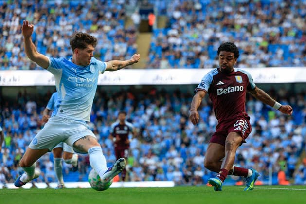 Manchester City v Aston Villa, Premier League Ian Maatsen (22) of Aston Villa sees his shot blocked by John Stones (5) of Manchester City the Premier League match between Manchester City and Aston Villa at the Etihad Stadium, Manchester, UK on 24 May 2026. Manchester Etihad Stadium Manchester UK Editorial use only DataCo restrictions apply See www.football-dataco.com , Copyright: xConorxMolloyx PSI-24291-0097