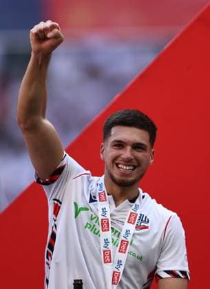 London, England, 24th May 2026. Xavier Simons of Bolton Wanderers celebrates victory during the Bolton Wanderers vs Stockport County Sky Bet League 1 play off final match at Wembley Stadium, London. Picture credit should read: Jake Youle Sportimage EDITORIAL USE ONLY. No use with unauthorised audio, video, data, fixture lists, club league logos or live services. Online in-match use limited to 120 images, no video emulation. No use in betting, games or single club league player publications. SPI_084_JY_Stockport_County_Bolton_Wanderers SPI-4821-0084