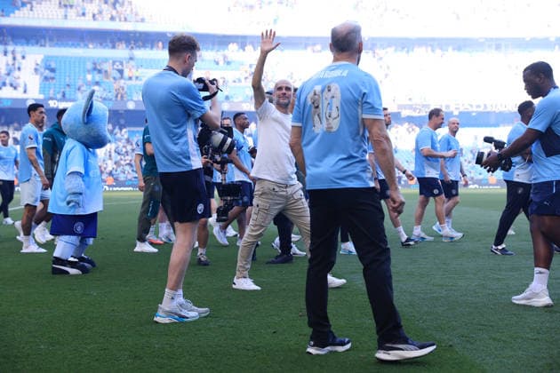 Football - Premier League - Manchester City v Aston Villa 24th May 2026 - Premier League - Manchester City v Aston Villa - Manchester City manager Pep Guardiola is surrounded as he waves farewell after the match - Photo: Simon Stacpoole Offside. Manchester UK Copyright: xSimonxStacpoolexOffside