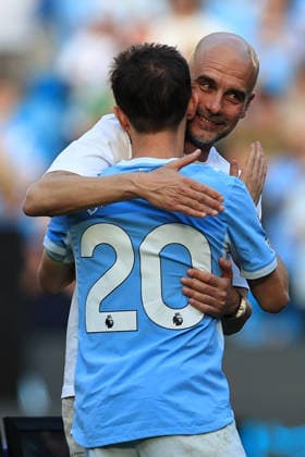 24th May 2026; Etihad Stadium, Manchester, Lancashire, England; Premier League Football, Manchester City versus Aston Villa; Manchester City manager Pep Guardiola hits Bernardo Silva during the presentation after the match DavidxBlunsden