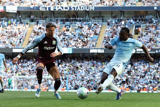 24th May 2026; Etihad Stadium, Manchester, Lancashire, England; Premier League Football, Manchester City versus Aston Villa; Jeremy Doku of Manchester City crosses the ball as Matty Cash of Aston Villa challenges DavidxBlunsden