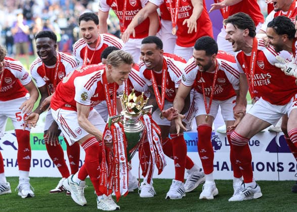 Crystal Palace v Arsenal 24 May 2026, London - Premier League Football - Crystal Palace v Arsenal - Martin Odegaard of Arsenal walks the Premier League trophy past his team mates before lifting it - Photo: Jacques Feeney Offside. London UK Copyright: xJacquesxFeeneyx xOffsidexOffside