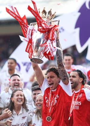 Crystal Palace v Arsenal 24 May 2026, London - Premier League Football - Crystal Palace v Arsenal - Riccardo Calafiori of Arsenal lifts the Premier League trophy - Photo: Jacques Feeney Offside. London UK Copyright: xJacquesxFeeneyx xOffsidexOffside
