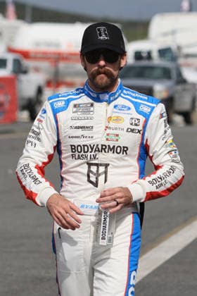 CHARLOTTE, NC - MAY 24: Ryan Blaney ( 12 Team Penske BODYARMOR FLASH I.V. Ford) walks in the garage area wearing a Hat honoring the late Kyle Busch prior to the running of the NASCAR, Motorsport, USA Cup Series Coca-Cola 600 on May 24, 2026 at Charlotte Motor Speedway in Charlotte, NC. (Photo by Jeff Robinson Icon Sportswire) AUTO: MAY 24 NASCAR Cup Series Coca-Cola 600 EDITORIAL USE ONLY Icon2605246407600