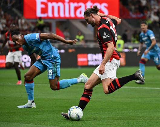 (260525) -- MILAN, May 25, 2026 -- AC Milan s Adrien Rabiot (R) vies with Cagliari s Yerry Mina during a Serie A football match between AC Milan and Cagliari in Milan, Italy, May 24, 2026. (SP)ITALY-MILAN-SOCCER-SERIE A-AC MILAN VS CAGLIARI LixJing 