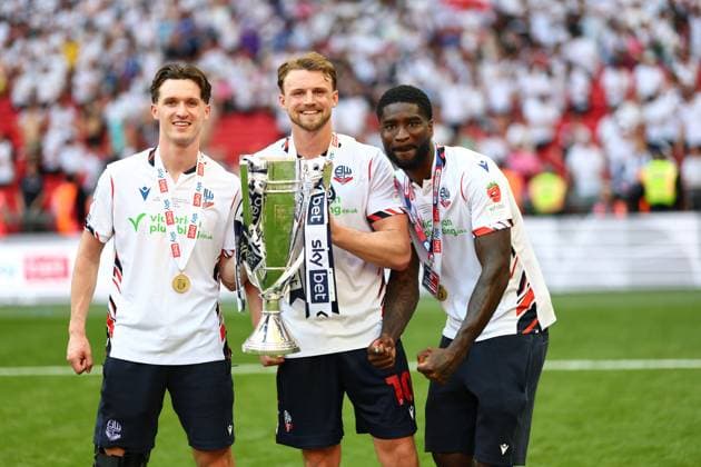 (Left to right) Johnny Kenny, Sam Dalby and Jordi Osei-Tutu of Bolton Wanderers celebrate after winning the Sky Bet EFL League One Play-off Final and promotion to the Sky Bet EFL Championship Bolton Wanderers v Stockport County, EFL Sky Bet League One, Play-Off Final, Football, Wembley Stadium, London, UK - 24 May 2026London Wembley Stadium United Kingdom EDITORIAL USE ONLY No use with unauthorised audio, video, data, fixture lists, club league logos or live services. Online in-match use limited to 120 images, no video emulation. No use in betting, games or single club league player publications.  Copyright: xSimonxDael Shutterstockx 16889811lg