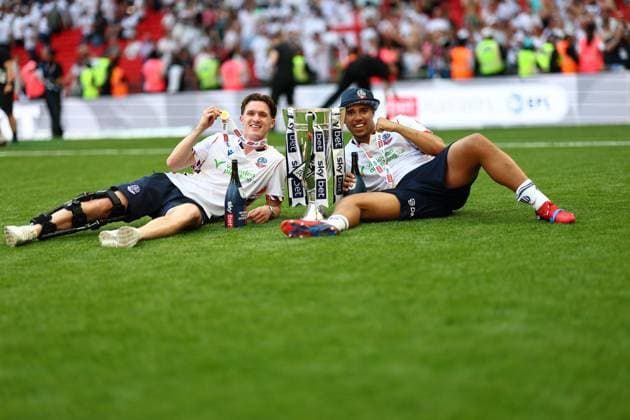 Johnny Kenny and Ethan Erhahon of Bolton Wanderers celebrate after winning the Sky Bet EFL League One Play-off Final and promotion to the Sky Bet EFL Championship Bolton Wanderers v Stockport County, EFL Sky Bet League One, Play-Off Final, Football, Wembley Stadium, London, UK - 24 May 2026London Wembley Stadium United Kingdom EDITORIAL USE ONLY No use with unauthorised audio, video, data, fixture lists, club league logos or live services. Online in-match use limited to 120 images, no video emulation. No use in betting, games or single club league player publications.  Copyright: xSimonxDael Shutterstockx 16889811li