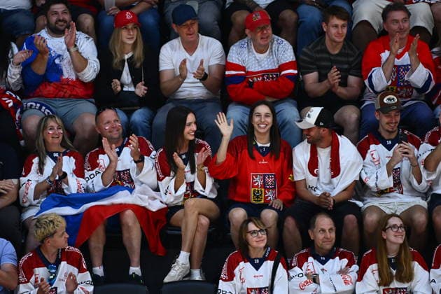 Olympic gold medalist Czech snowboarder Zuzana Maderova, in red, among Czech fans during the IIHF World Championship, WM, Weltmeisterschaft Group B match Czech Republic vs Norway on May 25, 2026, Fribourg, Switzerland. (CTKxPhoto RadekxPetrasek) CTKPhotoP2026052506251  CTKPhotoP2026052506251