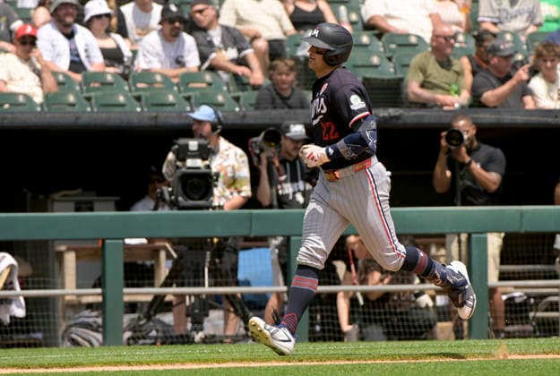 Minnesota Twins Brooks Lee (22) crosses home plate during his solo home run against the Chicago White Sox during the first inning at Rate Field in Chicago, IL on Monday, May 25, 2026.  CHI20260525106 MARKxBLACK