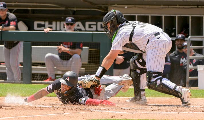 Chicago White Sox catcher Drew Romo (36) makes the tag on Minnesota Twins shortstop Orlando Arcia (11) on a long throw by right fielder Rikuu Nishida during the second inning at Rate Field in Chicago, IL on Monday, May 25, 2026.  CHI20260525115 MARKxBLACK