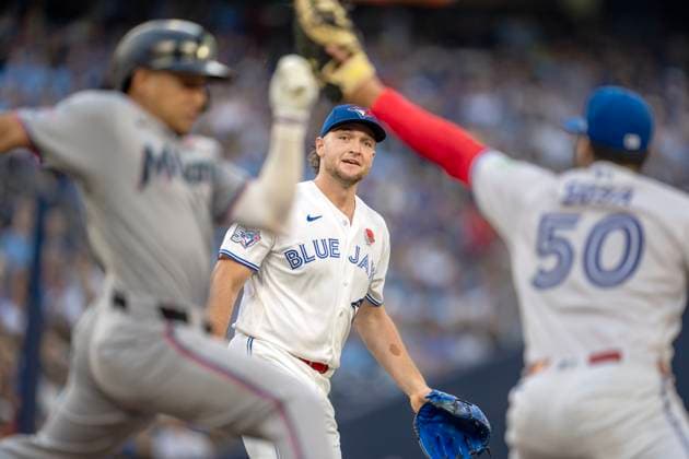 May 25, 2026, Toronto, On, CAN: Toronto Blue Jays pitcher Trey Yesavage (39) watches as his throw to first baseman Lenyn Sosa (50) puts out Miami Marlins Javier Sanoja (8) during first inning MLB, Baseball Herren, USA action in Toronto on Monday May 25, 2026. Canada News - May 25, 2026  - ZUMAc35_ 20260525_zaf_c35_169 Copyright: xFrankxGunnx
