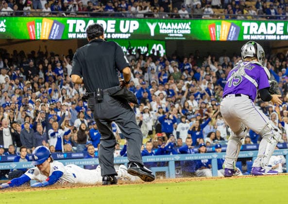 May 25, 2026, Los Angeles, California, United States: Hyeseong Kim 6 of the Los Angeles Dodgers safely slides into home plate to score a run during the game between the Colorado Rockies and the Los Angeles at Dodger Stadium on Monday, May 25, 2026 in Los Angeles, California.. Los Angeles United States - ZUMAa60_ 20260525_zaf_a60_013 Copyright: xArmandoxArorizox