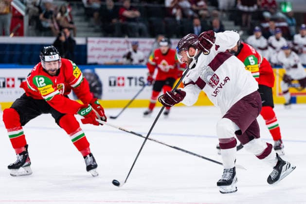 ZURICH, SWITZERLAND - MAY 26: Haralds Egle (Latvia, 97) shooting during the Preliminary Round - Group A Match 51 between Hungary and Latvia at the IIHF Ice hockey, Eishockey World Championship, WM, Weltmeisterschaft 2026, Swiss Life Arena on May 26, 2026 in Zurich, Switzerland. Zurich Switzerland Copyright: xTimoxSteinx