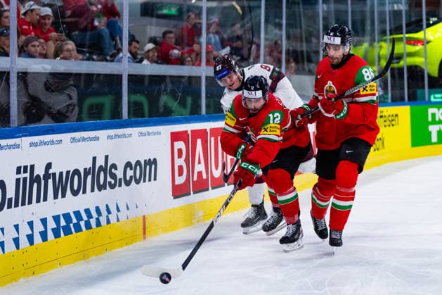 ZURICH, SWITZERLAND - MAY 26: Bence Stipsicz (Hungary, 12) in the battle for the puck with Kristaps Skrastins (Latvia, 87) during the Preliminary Round - Group A Match 51 between Hungary and Latvia at the IIHF Ice hockey, Eishockey World Championship, WM, Weltmeisterschaft 2026, Swiss Life Arena on May 26, 2026 in Zurich, Switzerland. Zurich Switzerland Copyright: xTimoxSteinx