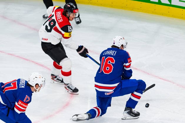 ZURICH, SWITZERLAND - MAY 26: Mason Lohrei (United States, 16) tying to stop the shot of Vinzenz Rohrer (Austria, 19) during the Preliminary Round - Group A Match 53 between United States and Austria at the IIHF Ice hockey, Eishockey World Championship, WM, Weltmeisterschaft 2026, Swiss Life Arena on May 26, 2026 in Zurich, Switzerland. Zurich Switzerland Copyright: xTimoxSteinx