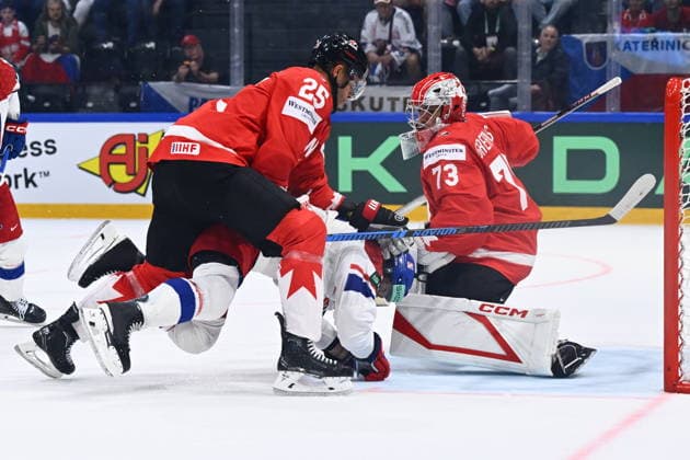 From left Darnell Nurse of Canada, Lukas Sedlak of Czech Republic and goalkeeper Jet Greaves of Canada in action during the IIHF World Championship, WM, Weltmeisterschaft Group B match Czech Republic vs Canada on May 26, 2026, Fribourg, Switzerland. (CTKxPhoto RadekxPetrasek) CTKPhotoP2026052608875  CTKPhotoP2026052608875
