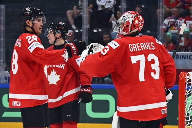 From left Zach Whitecloud, Macklin Celebrini and goalkeeper Jet Greaves of Canada celebrate after winning the IIHF World Championship, WM, Weltmeisterschaft Group B match Czech Republic vs Canada on May 26, 2026, Fribourg, Switzerland. (CTKxPhoto RadekxPetrasek) CTKPhotoP2026052609887  CTKPhotoP2026052609887