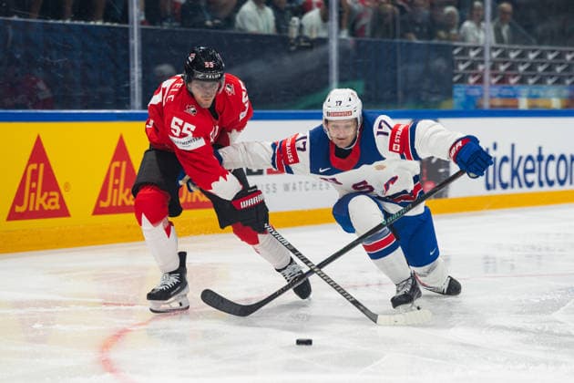FRIBOURG, FRIBOURG - MAY 28: Mark Scheifele of Canada battles with Will Borgen of the United States during the 2026 IIHF World Championship, WM, Weltmeisterschaft quarterfinal match between Canada and the United States at BCF Arena on May 28, 2026 in Fribourg, Fribourg, Switzerland.  Copyright: xLivioxBaeriswylx xSPPx Sportspressphoto_SPR156131