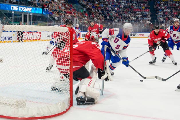 FRIBOURG, SWITZERLAND - MAY 28: Oliver Moore of United States C) against goalkeeper Jet Greaves of Canada during the 2026 IIHF Ice hockey, Eishockey World Championship, WM, Weltmeisterschaft Switzerland game between Canada and USA at BCF Arena on May 28, 2026 in Fribourg, Fribourg. Fribourg BCF Arena Fribourg Switzerland Copyright: xJustPictures.ch JarixPestelaccix jp-en-EuSpIm-JP6_JAR_Canada_USA_28May2026_00136