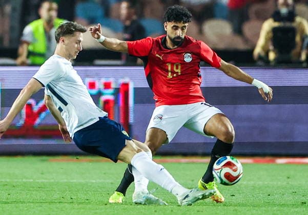 EGYPT, CAIRO - MAY 28, 2026: Russia s Anton Miranchuk (L) and Egypt s Marwan Attia fight for the ball in a friendly football match between Egypt and Russia at the Cairo International Stadium. Peter Kovalev TASS  93143704
