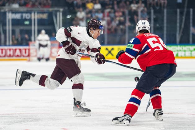 FRIBOURG, FRIBOURG - MAY 28: Oskars Lapinskis of Latvia attempts a shot against Sander Hurrod of Norway during the 2026 IIHF World Championship, WM, Weltmeisterschaft match between Norway and Latvia at BCF Arena on May 28, 2026 in Fribourg, Fribourg, Switzerland.  Copyright: xLivioxBaeriswylx xSPPx Sportspressphoto_SPR156295
