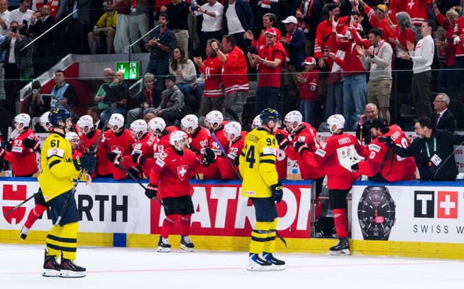 260528 Viggo Björck and Joel Persson of Sweden look dejected while Nino Niederreiter of Switzerland celebrates after 2-1 during the 2026 IIHF Ice hockey, Eishockey World Championship, WM, Weltmeisterschaft quarterfinal match between Switzerland and Sweden on May 28, 2026 in Zürich. Photo: Jesper Zerman BILDBYRAN kod JZ JZ0733 ishockey ice hockey ishockey-vm 2026 vm 2026 iihf world championship kvartsfinal quarterfinal quarterfinals switzerland schweiz sverige sweden bbeng depp jubel Copyright: JESPERxZERMAN BB260528JZ134