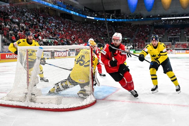 ZURICH, SWITZERLAND - MAY 28: Nico Hischier of Switzerland in action between goalkeeper Magnus Hellberg of Sweden L) and Joel Persson of Sweden R) during the 2026 IIHF Ice hockey, Eishockey World Championship, WM, Weltmeisterschaft Switzerland game between Switzerland and Sweden at Swiss Life Arena on May 28, 2026 in Zurich, Zurich. Zurich Swiss Life Arena Zurich Switzerland Copyright: xJustPictures.ch AndreaxBrancax jp-en-EuSpIm-JP7_ANB_FinCze_28052026_5338