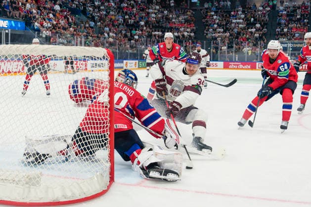 FRIBOURG, SWITZERLAND - MAY 28: Eduards Tralmaks of Latvia 2nd L) against goalkeeper Henrik Haukeland of Norway during the 2026 IIHF Ice hockey, Eishockey World Championship, WM, Weltmeisterschaft Switzerland game between Norway and Latvia at BCF Arena on May 28, 2026 in Fribourg, Fribourg. Fribourg BCF Arena Fribourg Switzerland Copyright: xJustPictures.ch JarixPestelaccix jp-en-EuSpIm-JP6_JAR_Norway_Latvia_28May2026_00130