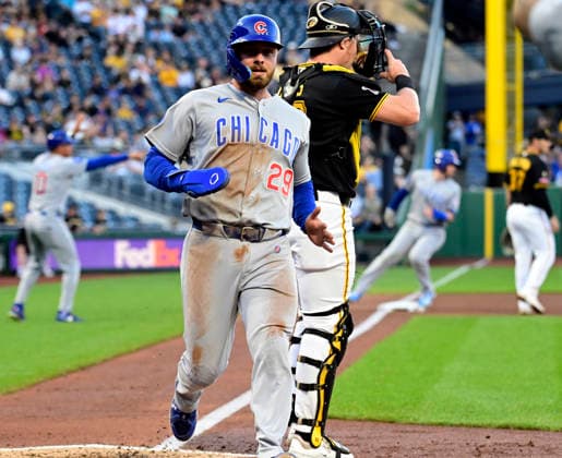 Chicago Cubs first baseman Michael Busch (29) scores on a Cubs Seiya Suzuki single in the fourth inning against the Pittsburgh Pirates at PNC Park on Thursday, May 28, 2026 in Pittsburgh.  PIT2026052814 ArchiexCarpenter