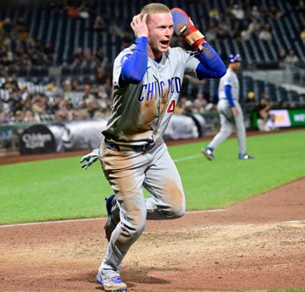 Chicago Cubs center fielder Pete Crow-Armstrong (4) reacts after sliding into home, the Chicago Cubs challenges and the original out call was overturned in the ninth inning of the Cubs 7-2 win at PNC Park on Thursday, May 28, 2026 in Pittsburgh.  PIT2026052831 ArchiexCarpenter