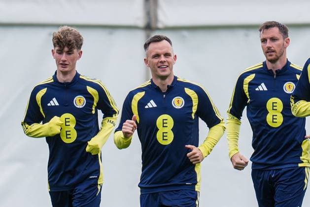 Lawrence Shankland of Scotland runs at the front of the squad, flanked by James Wilson & Dominic Hyam as they run a lap of the Lesser Hampden pitch Scotland Team Training, Football, Hampden Park, Glasgow, Scotland, UK - 29 May 2026Glasgow Hampden Park United Kingdom EDITORIAL USE ONLY No use with unauthorised audio, video, data, fixture lists, club league logos or live services. Online in-match use limited to 120 images, no video emulation. No use in betting, games or single club league player publications. Copyright: xStuartxWallace Shutterstockx 16902976bf