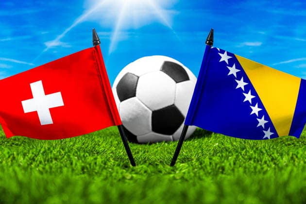 May 22, 2026: PHOTO MONTAGE, 2026 FIFA World Cup, WM, Weltmeisterschaft, Fussball National flags of Switzerland and Bosnia and Herzegovina with a soccer ball on the field. Illustrative image for the group stage match on June 18 at the 2026 FIFA World Cup *** FOTOMONTAGE, Fußball-Weltmeisterschaft 2026: Nationalflaggen von Schweiz und Bosnien Herzegowina mit Fußball auf Rasen. Symbolbild zum WM-Gruppenspiel am 18 Juni bei der FIFA Fussball-Weltmeisterschaft 2026