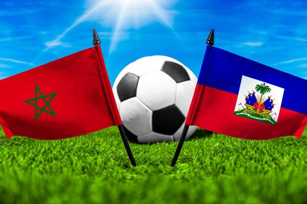 May 22, 2026: PHOTO MONTAGE, 2026 FIFA World Cup, WM, Weltmeisterschaft, Fussball National flags of Morocco and Haiti with a soccer ball on the field. Stock image for the group stage match on June 25 at the 2026 FIFA World Cup *** FOTOMONTAGE, Fußball-Weltmeisterschaft 2026: Nationalflaggen von Marokko und Haiti mit Fußball auf Rasen. Symbolbild zum WM-Gruppenspiel am 25 Juni bei der FIFA Fussball-Weltmeisterschaft 2026