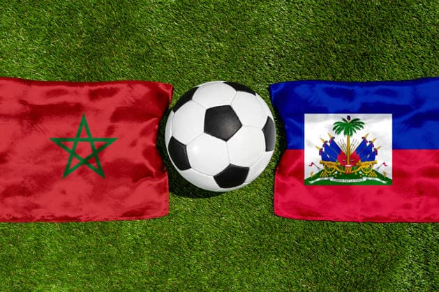 May 22, 2026: PHOTO MONTAGE, 2026 FIFA World Cup, WM, Weltmeisterschaft, Fussball National flags of Morocco and Haiti with a soccer ball on the field. Stock image for the group stage match on June 25 at the 2026 FIFA World Cup *** FOTOMONTAGE, Fußball-Weltmeisterschaft 2026: Nationalflaggen von Marokko und Haiti mit Fußball auf Rasen. Symbolbild zum WM-Gruppenspiel am 25 Juni bei der FIFA Fussball-Weltmeisterschaft 2026
