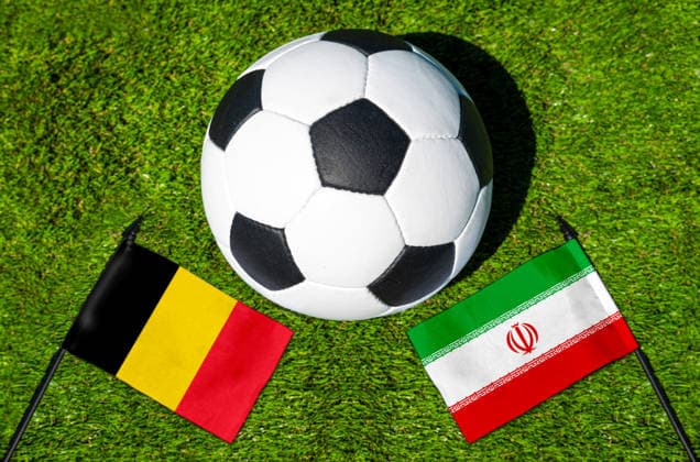 May 22, 2026: PHOTO MONTAGE, 2026 FIFA World Cup, WM, Weltmeisterschaft, Fussball National flags of Belgium and Iran with a soccer ball on the field. Illustrative image for the group stage match on June 21 at the 2026 FIFA World Cup *** FOTOMONTAGE, Fußball-Weltmeisterschaft 2026: Nationalflaggen von Belgien und Iran mit Fußball auf Rasen. Symbolbild zum WM-Gruppenspiel am 21 Juni bei der FIFA Fussball-Weltmeisterschaft 2026