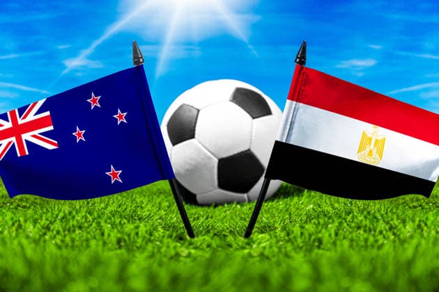 May 22, 2026: PHOTO MONTAGE, 2026 FIFA World Cup, WM, Weltmeisterschaft, Fussball National flags of New Zealand and Egypt with a soccer ball on a field. Stock image for the group stage match on June 22 at the 2026 FIFA World Cup *** FOTOMONTAGE, Fußball-Weltmeisterschaft 2026: Nationalflaggen von Neuseeland und Ägypten mit Fußball auf Rasen. Symbolbild zum WM-Gruppenspiel am 22 Juni bei der FIFA Fussball-Weltmeisterschaft 2026