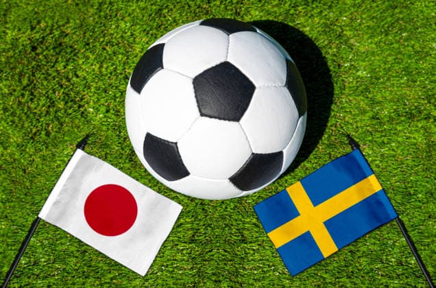 May 22, 2026: PHOTO MONTAGE, 2026 FIFA World Cup, WM, Weltmeisterschaft, Fussball National flags of Japan and Sweden with a soccer ball on the field. Illustrative image for the group stage match on June 26 at the 2026 FIFA World Cup *** FOTOMONTAGE, Fußball-Weltmeisterschaft 2026: Nationalflaggen von Japan und Schweden mit Fußball auf Rasen. Symbolbild zum WM-Gruppenspiel am 26 Juni bei der FIFA Fussball-Weltmeisterschaft 2026