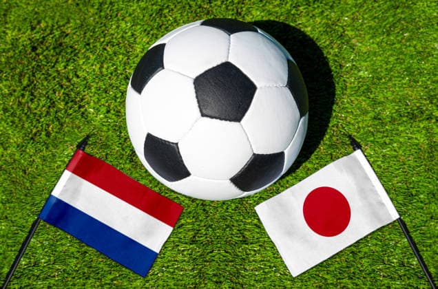 May 22, 2026: PHOTO MONTAGE, 2026 FIFA World Cup, WM, Weltmeisterschaft, Fussball National flags of the Netherlands and Japan with a soccer ball on the field. Illustrative image for the group stage match on June 14 at the 2026 FIFA World Cup *** FOTOMONTAGE, Fußball-Weltmeisterschaft 2026: Nationalflaggen von Niederlande und Japan mit Fußball auf Rasen. Symbolbild zum WM-Gruppenspiel am 14 Juni bei der FIFA Fussball-Weltmeisterschaft 2026