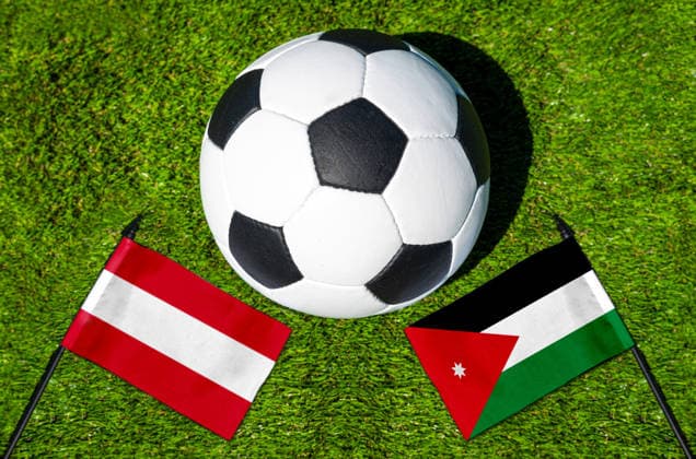 May 22, 2026: PHOTO MONTAGE, 2026 FIFA World Cup, WM, Weltmeisterschaft, Fussball National flags of Austria and Jordan with a soccer ball on the field. Illustrative image for the group stage match on June 17 at the 2026 FIFA World Cup *** FOTOMONTAGE, Fußball-Weltmeisterschaft 2026: Nationalflaggen von Österreich und Jordanien mit Fußball auf Rasen. Symbolbild zum WM-Gruppenspiel am 17 Juni bei der FIFA Fussball-Weltmeisterschaft 2026