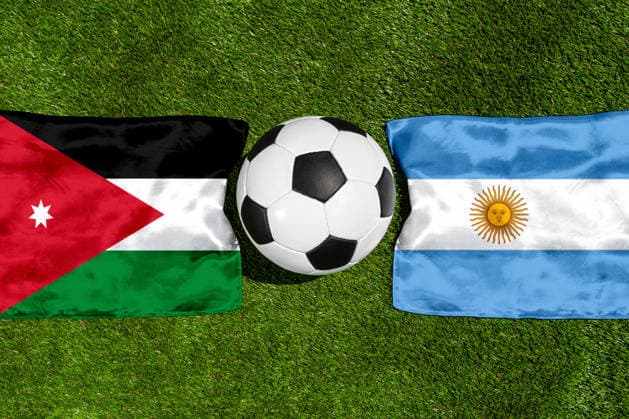 May 22, 2026: PHOTO MONTAGE, 2026 FIFA World Cup, WM, Weltmeisterschaft, Fussball National flags of Jordan and Argentina with a soccer ball on the field. Illustrative image for the group stage match on June 28 at the 2026 FIFA World Cup *** FOTOMONTAGE, Fußball-Weltmeisterschaft 2026: Nationalflaggen von Jordanien und Argentinien mit Fußball auf Rasen. Symbolbild zum WM-Gruppenspiel am 28 Juni bei der FIFA Fussball-Weltmeisterschaft 2026