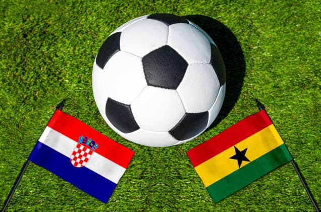 May 22, 2026: PHOTO MONTAGE, 2026 FIFA World Cup, WM, Weltmeisterschaft, Fussball National flags of Croatia and Ghana with a soccer ball on the field. Stock image for the group stage match on June 27 at the 2026 FIFA World Cup *** FOTOMONTAGE, Fußball-Weltmeisterschaft 2026: Nationalflaggen von Kroatien und Ghana mit Fußball auf Rasen. Symbolbild zum WM-Gruppenspiel am 27 Juni bei der FIFA Fussball-Weltmeisterschaft 2026